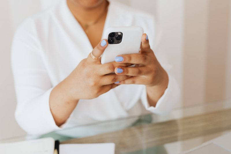 Woman receiving her same-day mammogram results on smartphone.